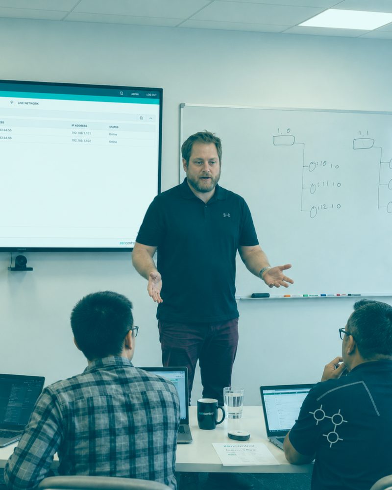 Instructor teaching the Advanced Wireless Course in front of a whiteboard