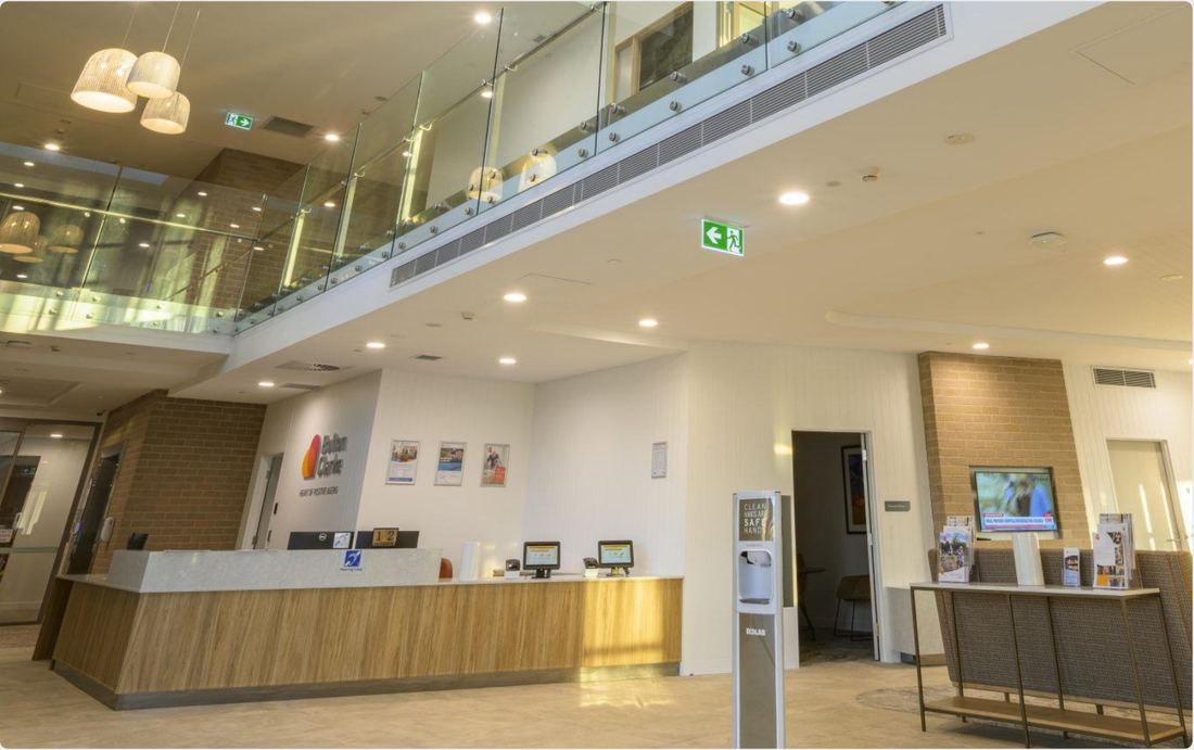 Building reception with monitored emergency exit lighting